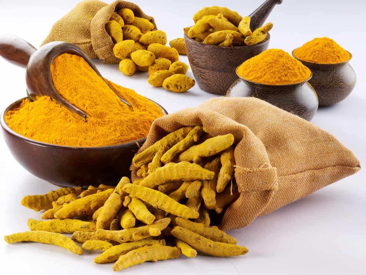 a bag of turmeric and turmeric powder